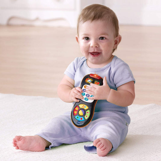 Close-up of VTech remote buttons showing colors, numbers, and shapes