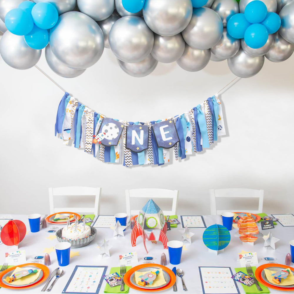 WAUAO rocket design element helps create a themed baby milestone moment