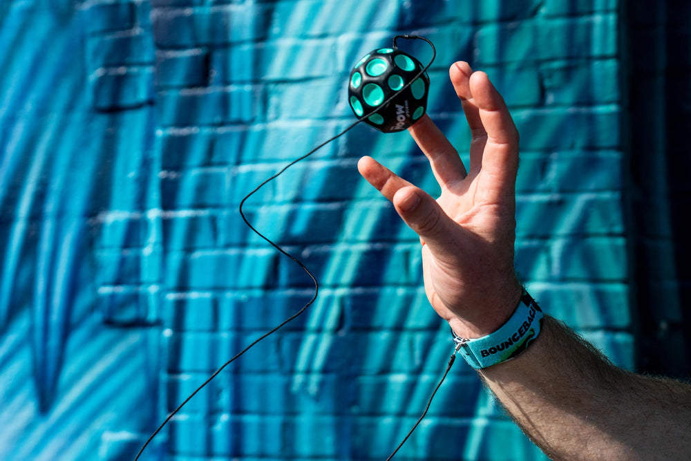 Waboba Bounceback Returning Moon packaging carded blister, portable fun for travel.
