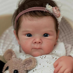 Wamdoll kit includes clothes, bottle, pacifier, birth certificate for complete playtime.