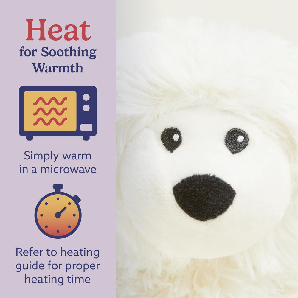 Warmies Sheep heated plush on a lap for bedtime warmth.