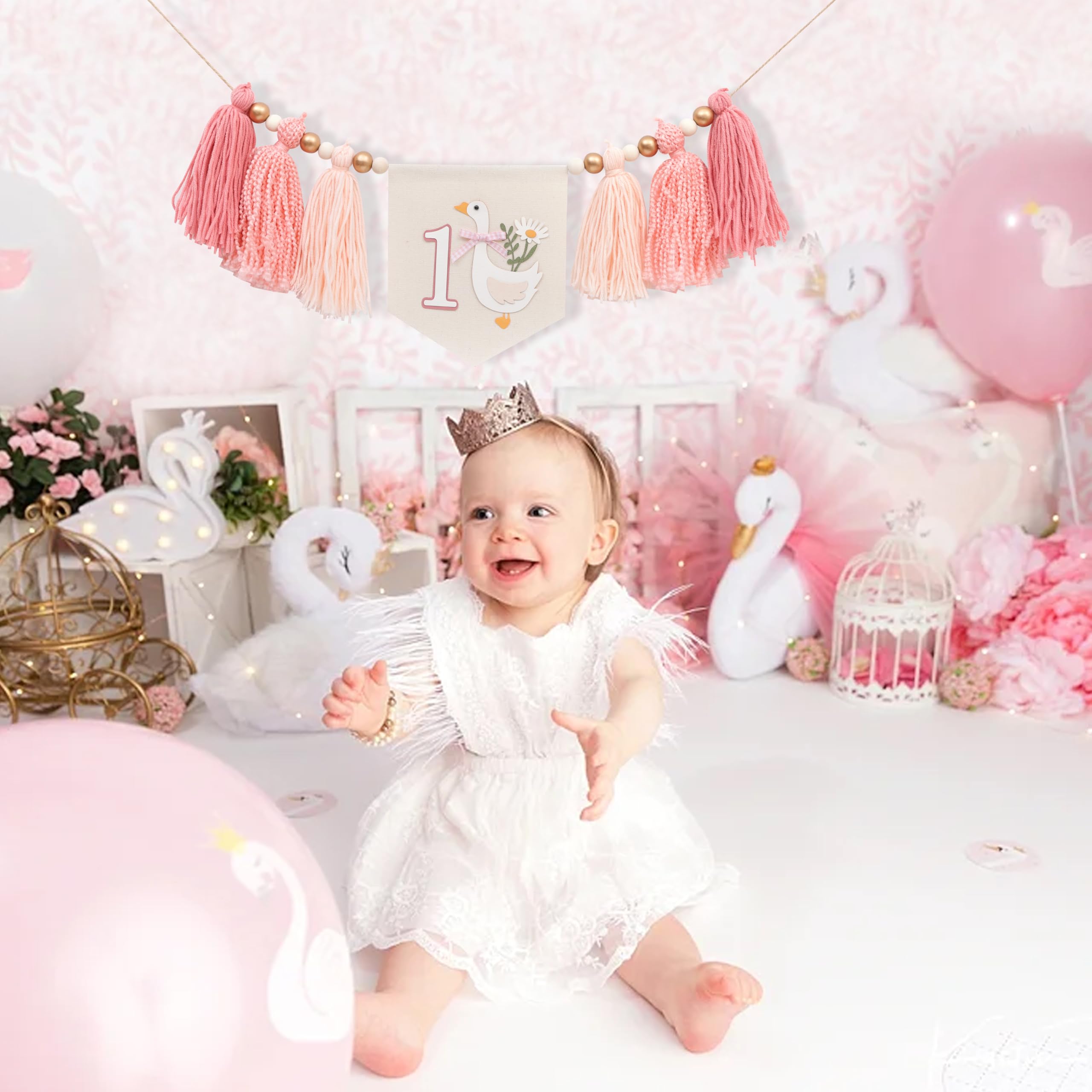 WAWUO pink tassel garland creates a soft celebratory backdrop