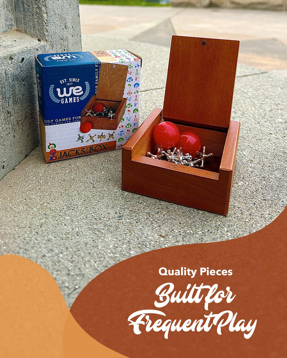 WE Games gold jacks paired with red balls for family play.