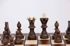 Wegiel hornbeam and sycamore pieces showcase carved details and durability.