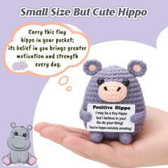 Weming hippo desk buddy perched on monitor shelf for daily motivation