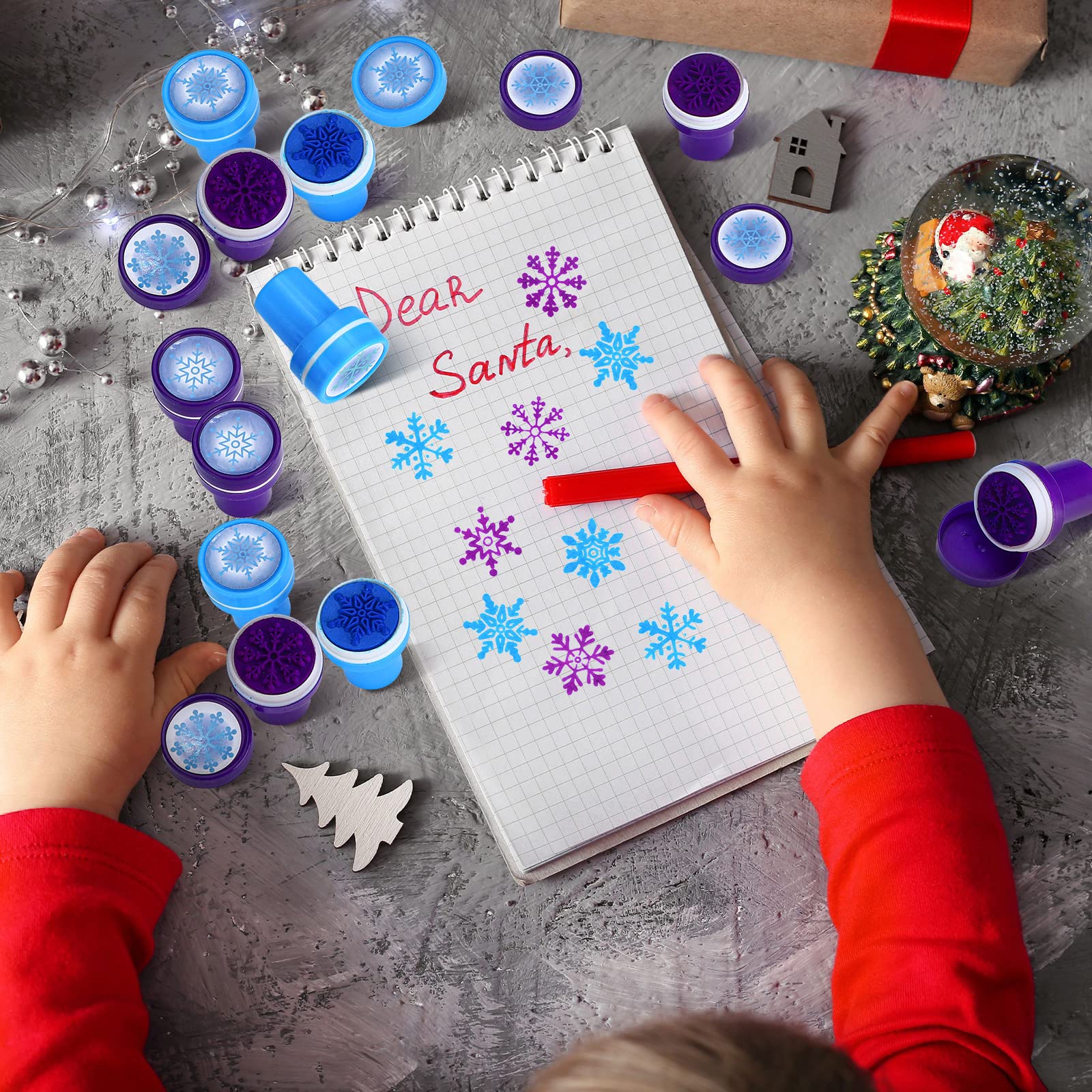 WillBond stamping action snowflake designs on cards and favors.