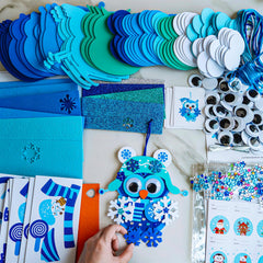 Winlyn beak-stickers provide precise facial features for expressive ornaments.