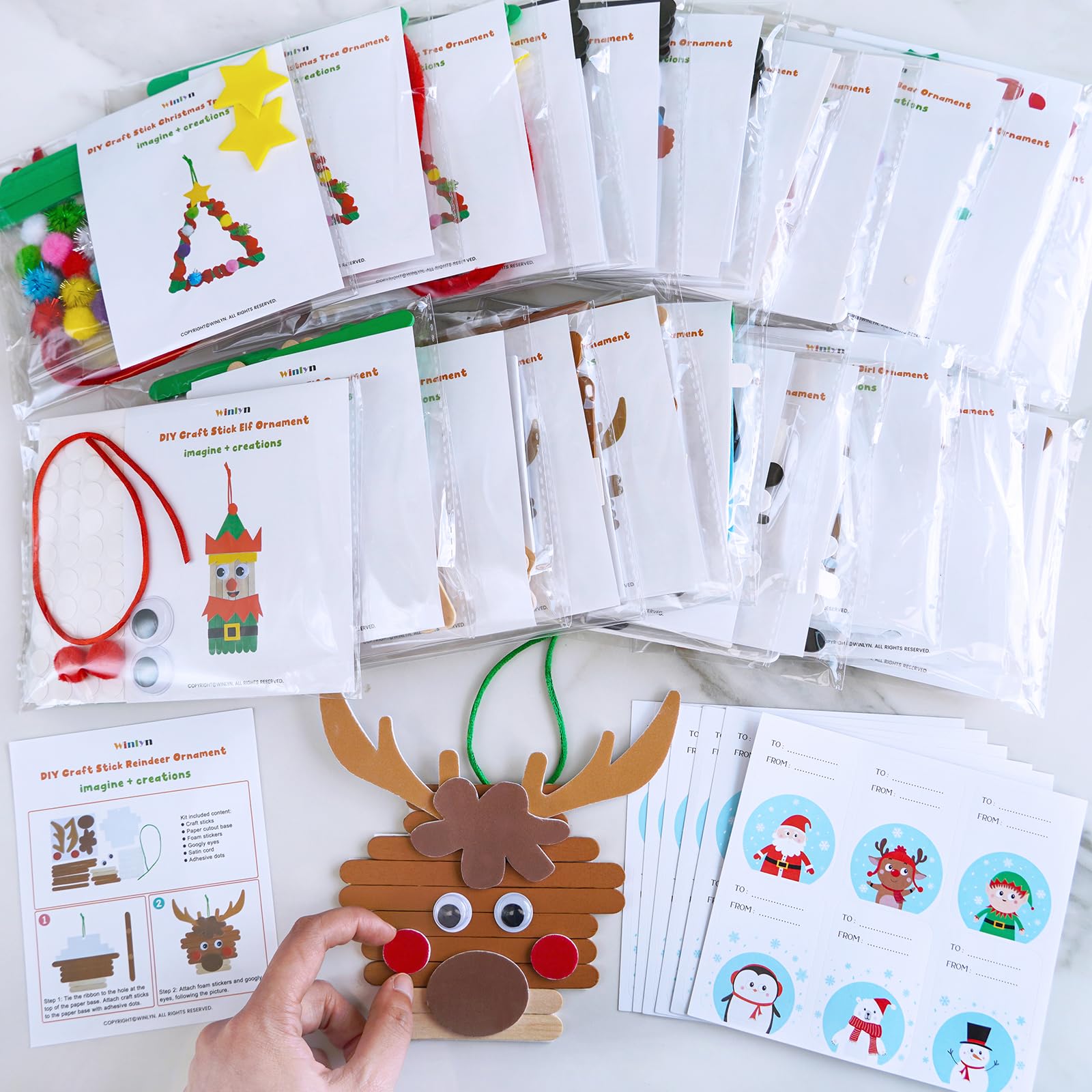 Winlyn snowman ornament kit with cheerful features for kids.
