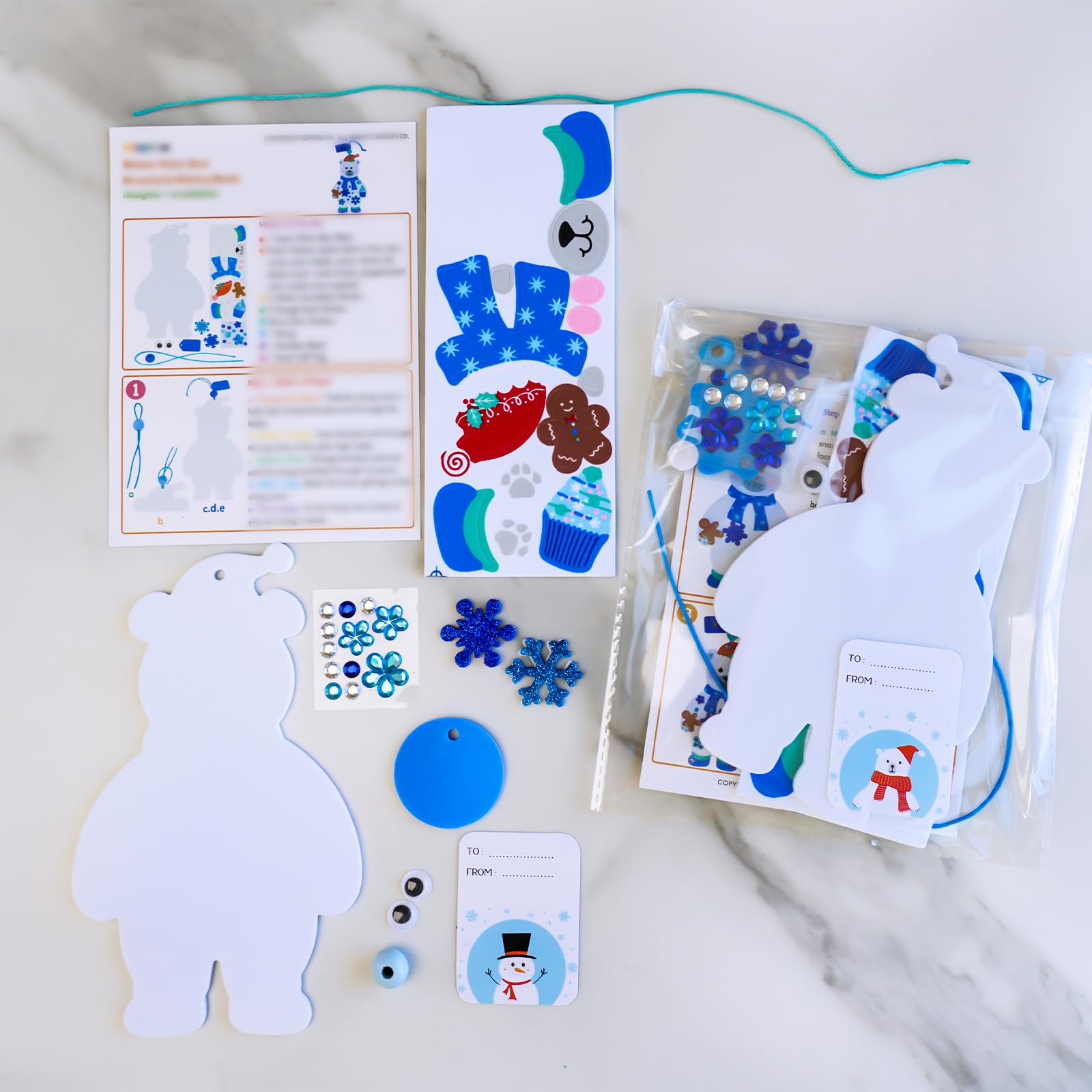 Winlyn glitter snowflake stickers sparkle on finished ornaments and seasonal decor.