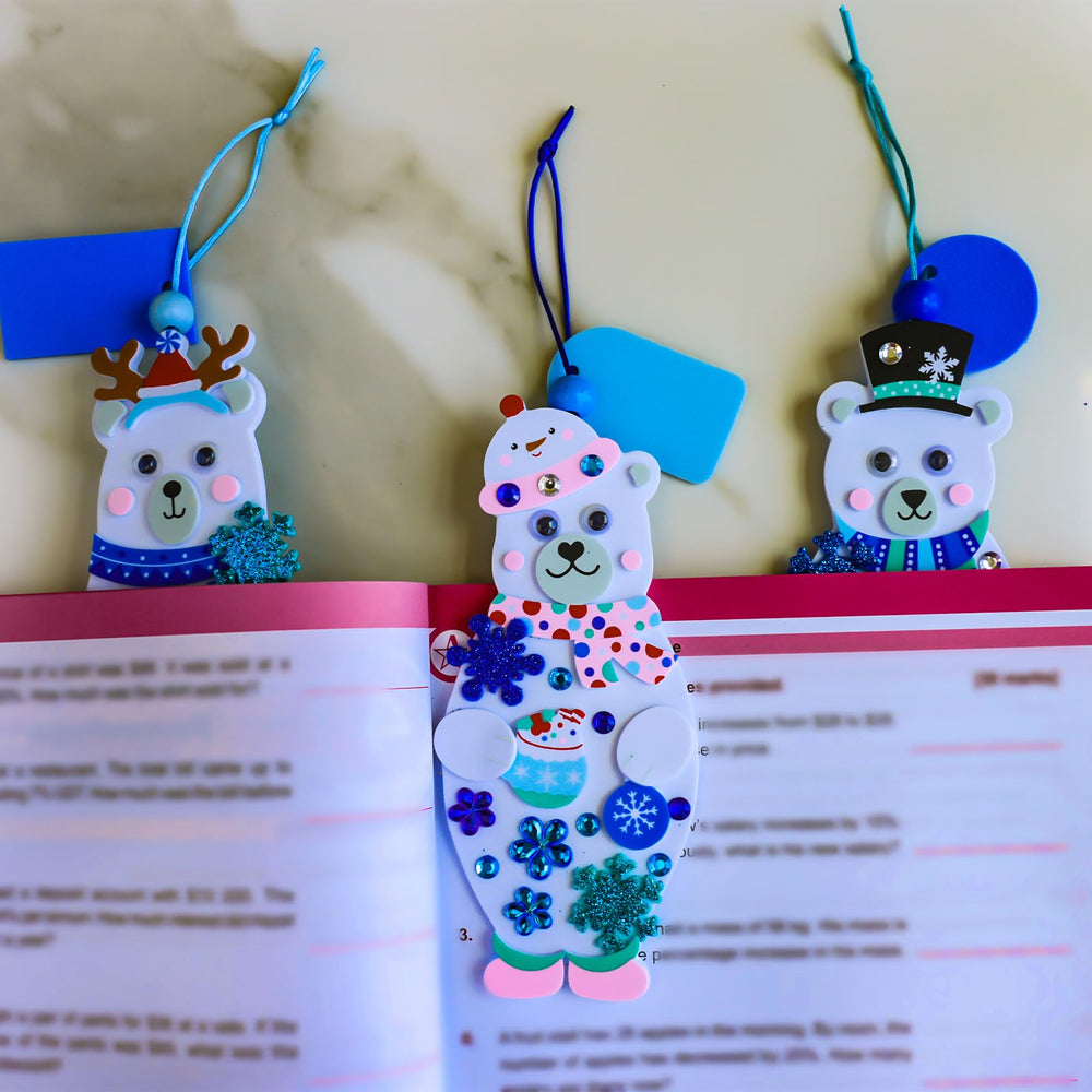 Winlyn polar bear bookmark kit shows kids applying colorful holiday stickers for creative projects.