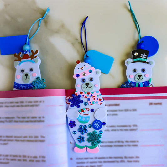 Winlyn polar bear bookmark kit shows kids applying colorful holiday stickers for creative projects.
