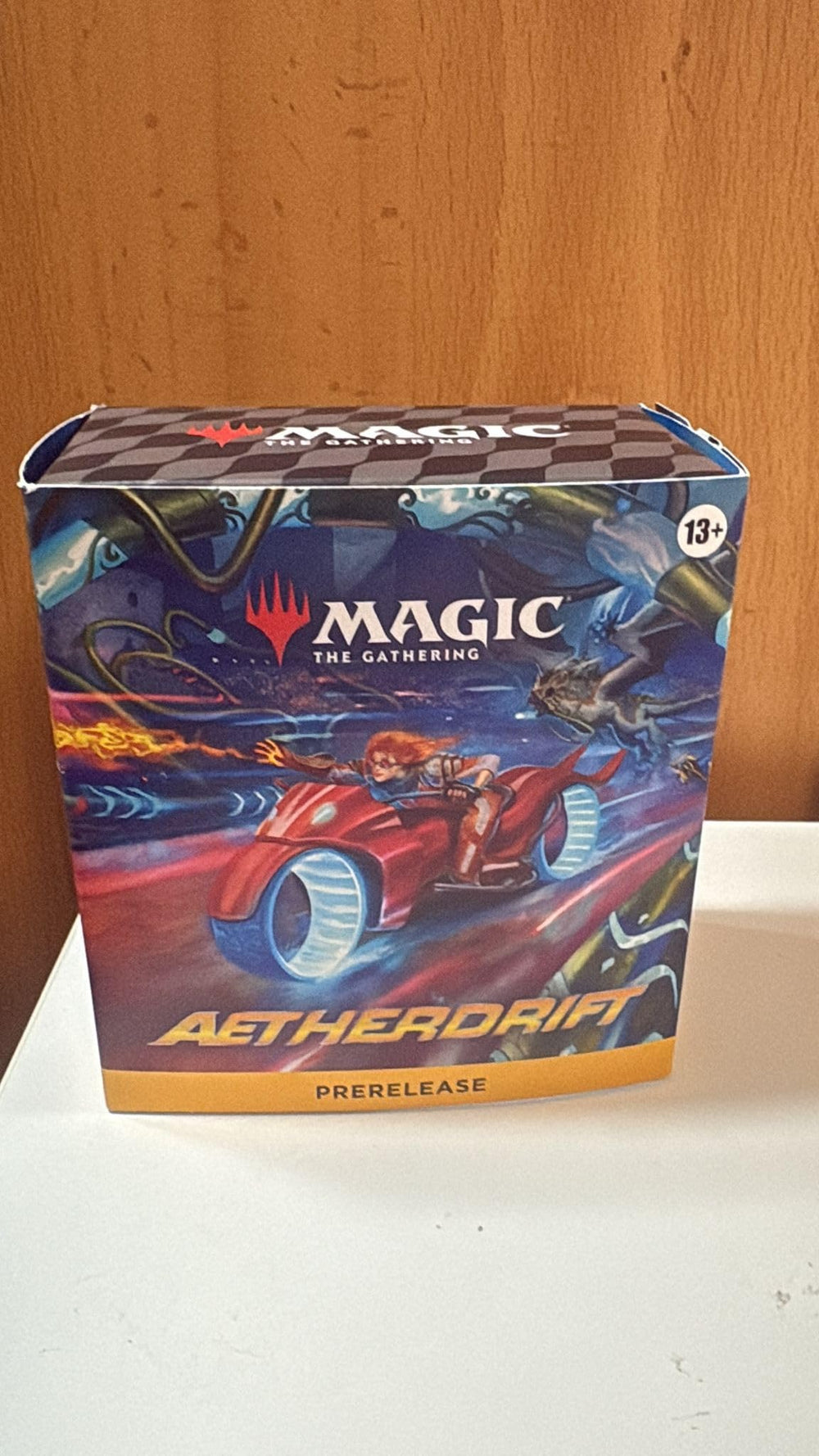 Wizards of the Coast Aetherdrift prerelease pack cover showcases premium MTG design for collectors.