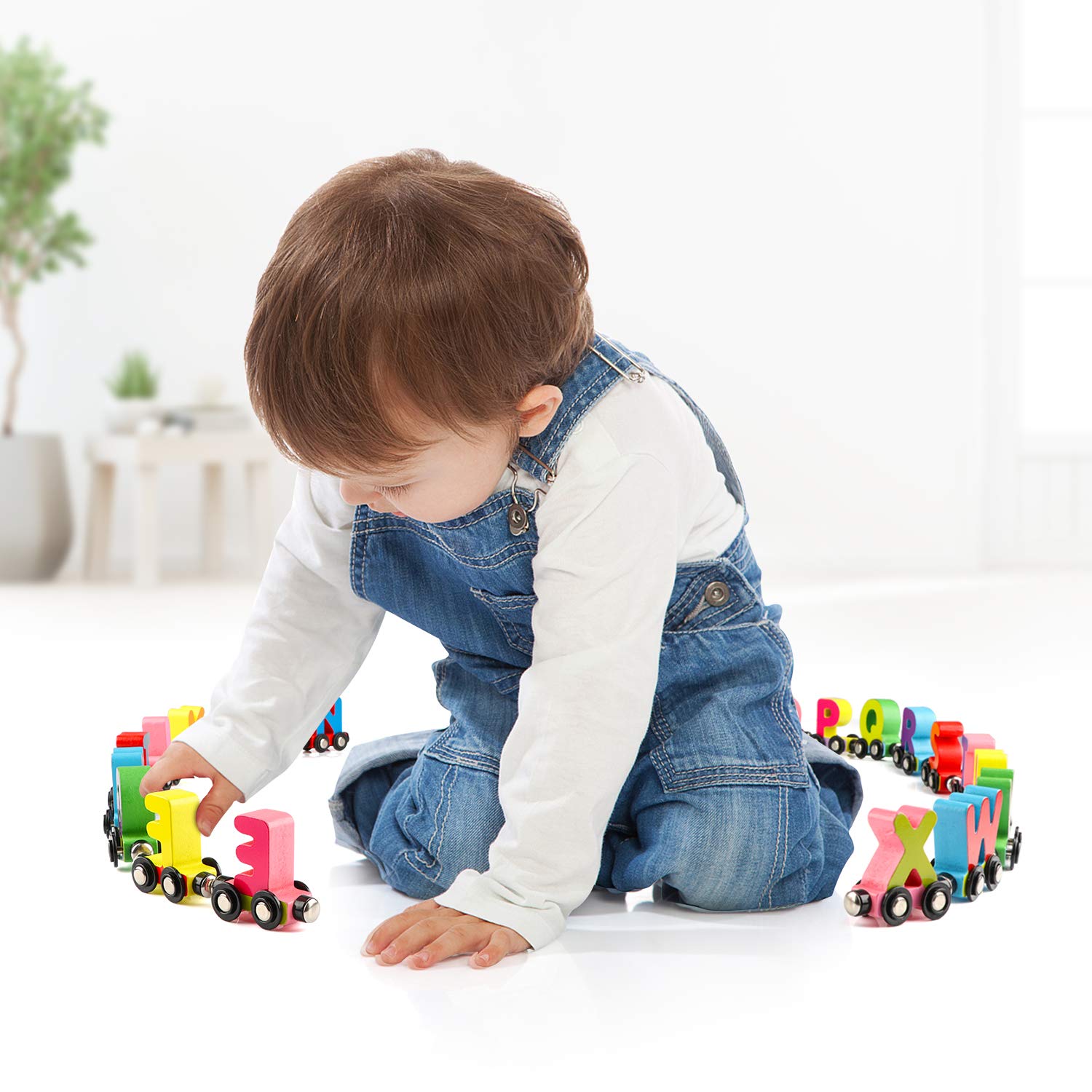 Wondertoys alphabet train cars connected by magnets for longer sequences.