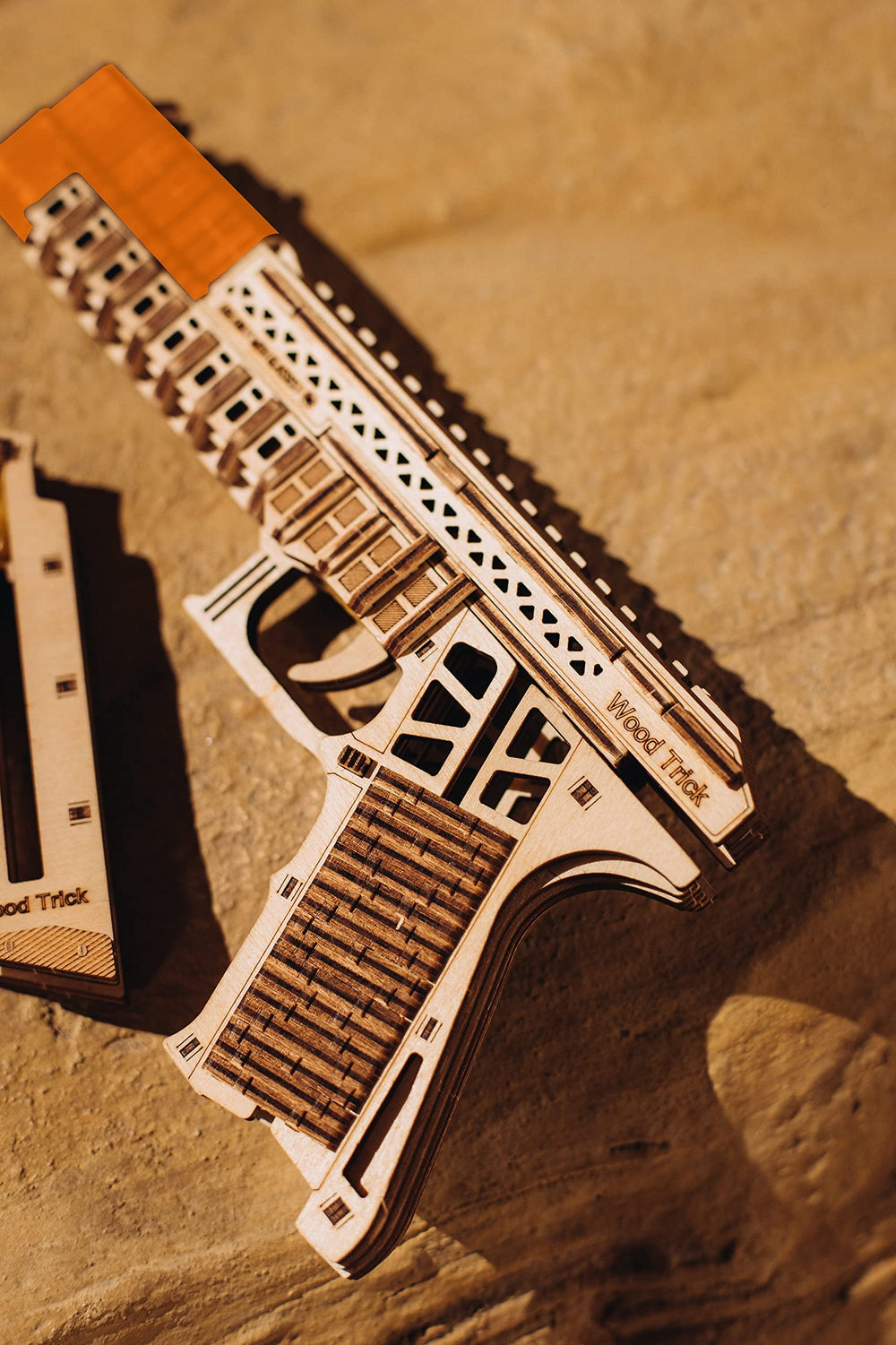 Wood Trick Defenders Gun two magazines highlight the eight wooden bullets