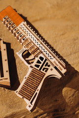 Wood Trick Defenders Gun two magazines highlight the eight wooden bullets