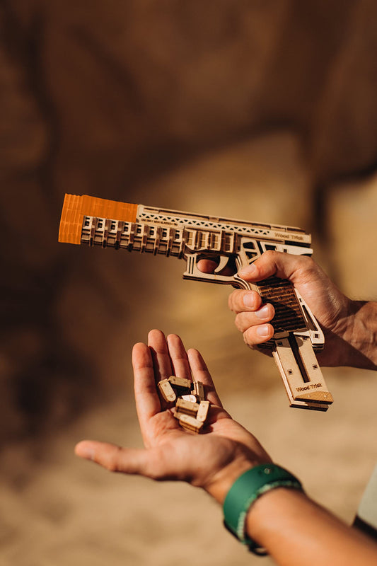 Wood Trick Defenders Gun trigger detail illustrating the interactive mechanism