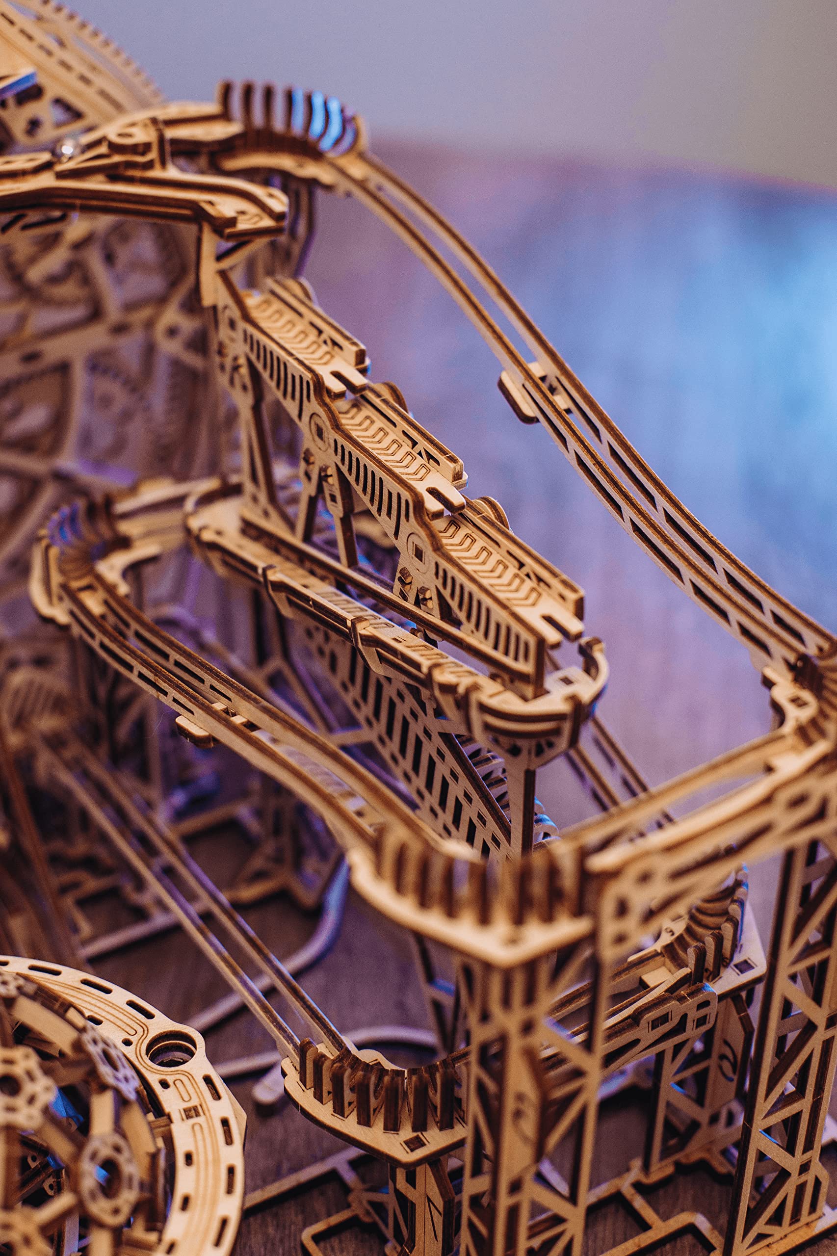 Wood Trick Marble Run three tracks converge, creating planetary motion feel for curiosity.