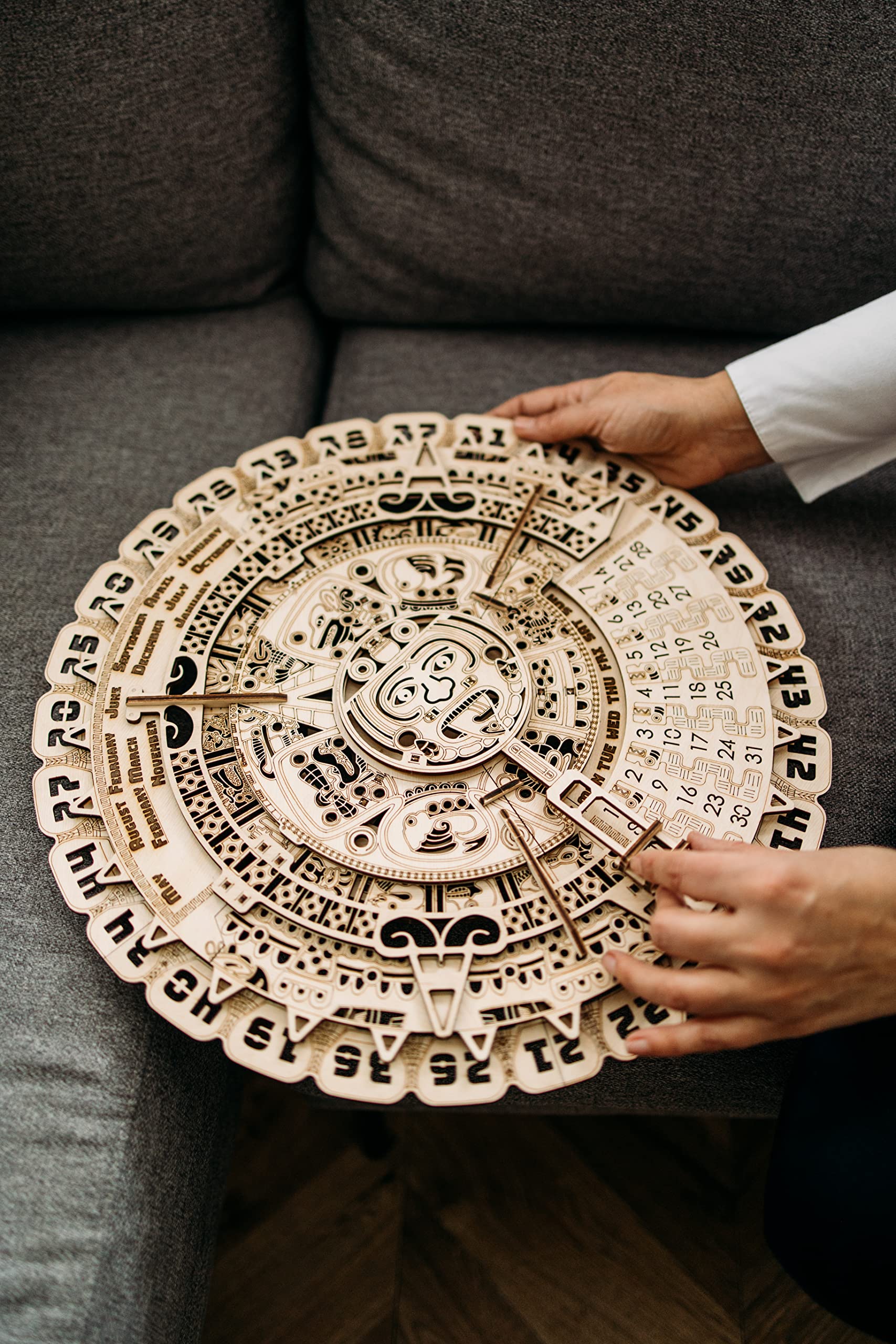 Wood Trick Mayan calendar front-dial detail highlights movable patterns for date tracking.