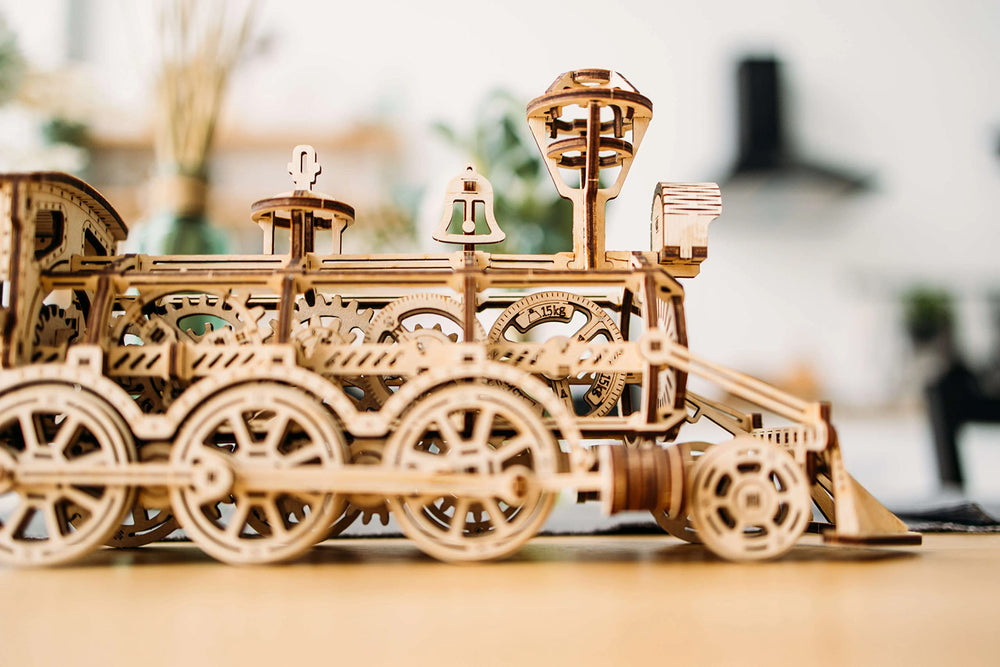 Wood Trick rails and model illustrate running train concept.