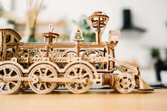 Wood Trick rails and model illustrate running train concept.
