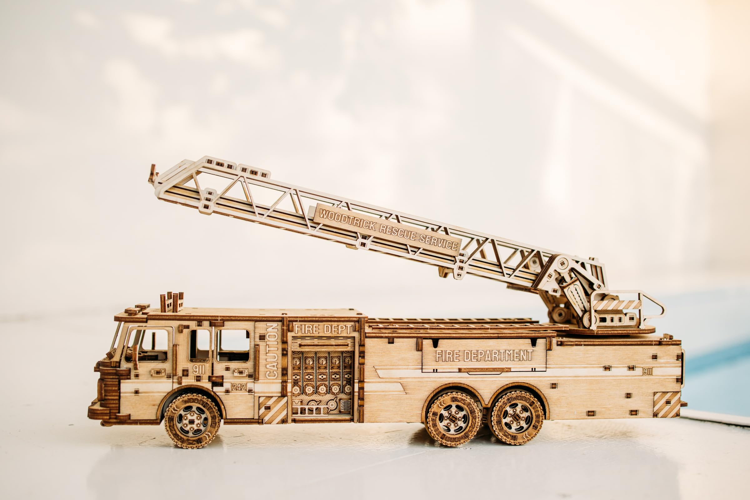 Wood Trick Rescue Firetruck dimensions show a compact, display-ready model.