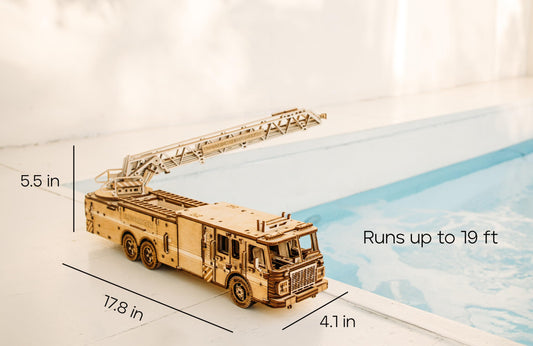 Wood Trick Rescue Firetruck ladder rotation demonstrates a rotating aerial feature for interactive play and learning.