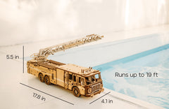 Wood Trick Rescue Firetruck ladder rotation demonstrates a rotating aerial feature for interactive play and learning.