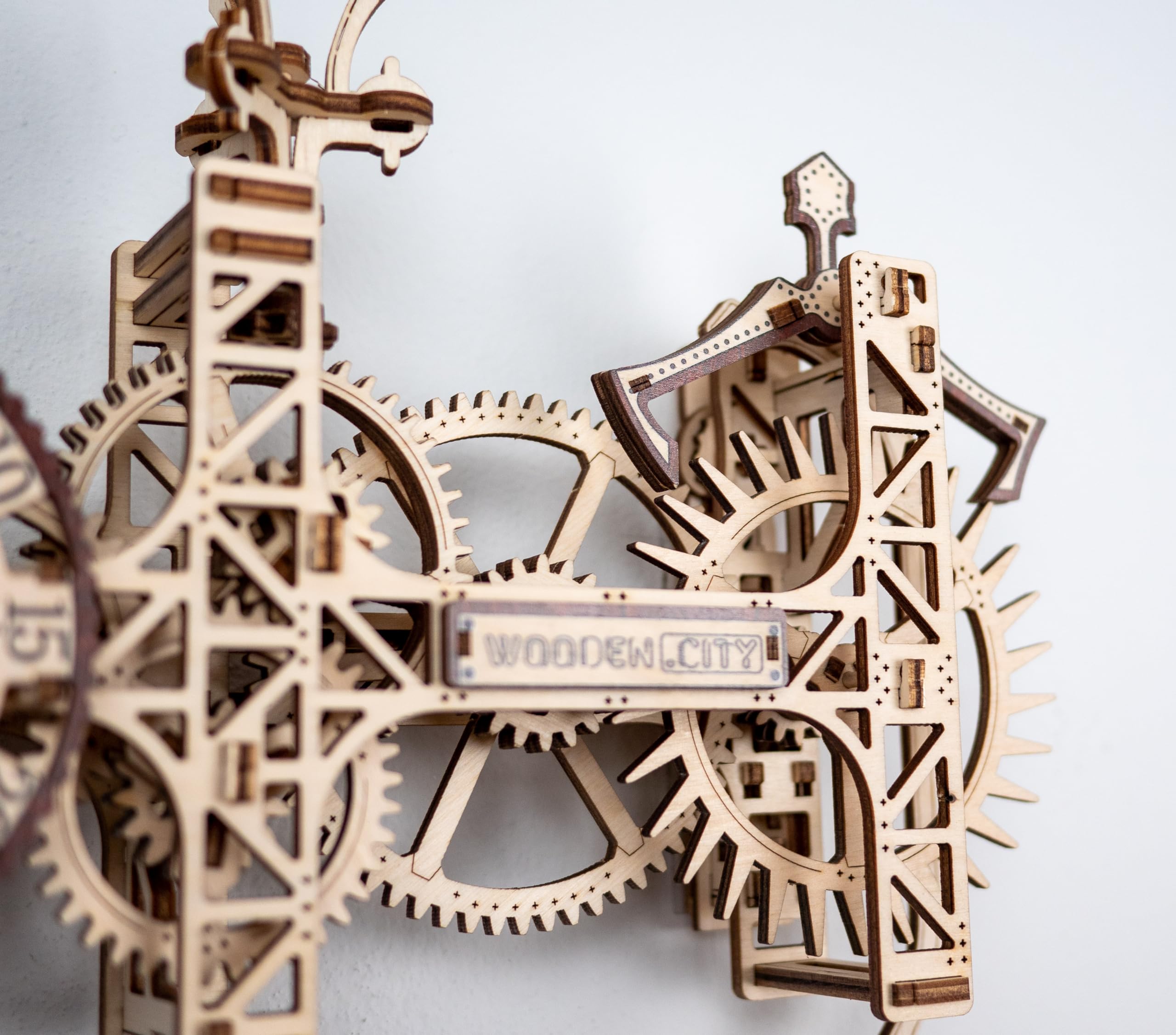 WOODEN.CITY pendulum in motion for tactile steampunk charm on display.