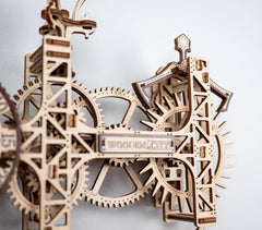 WOODEN.CITY pendulum in motion for tactile steampunk charm on display.