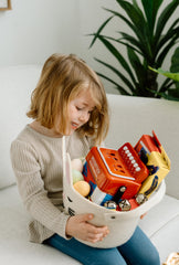 Woodstock Chimes Kid's Accordion 7in red, child playing, encourages hands-on musical play.