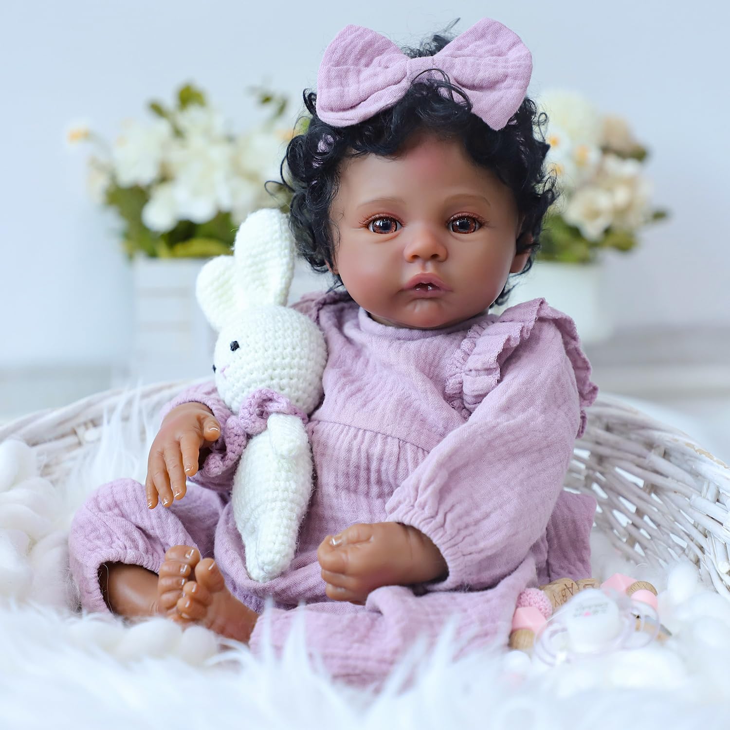 WOOROY Realistic Reborn Baby Doll 18-inch curly hair with pink bow for charming styling