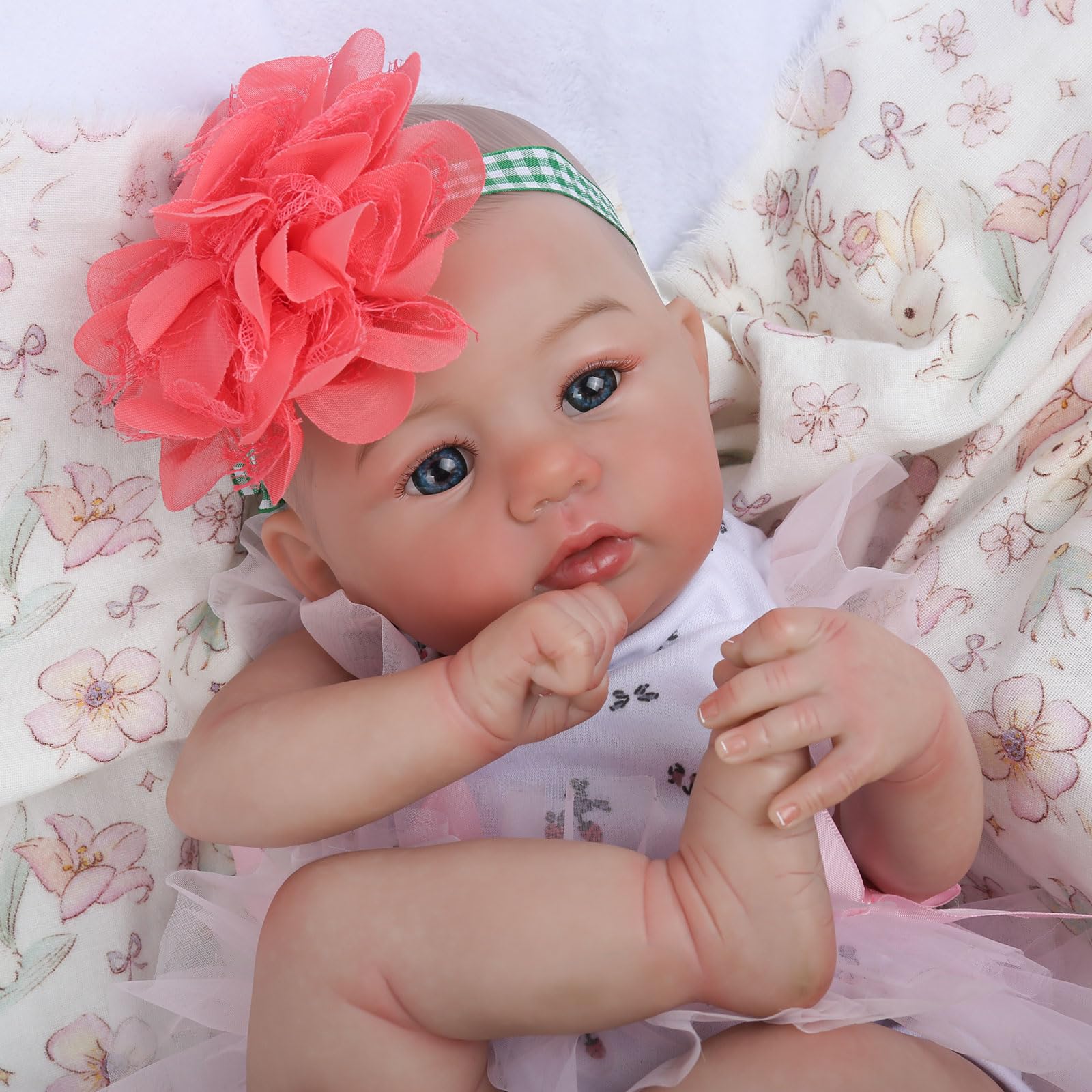 WOOROY reborn doll with blue eyes in a calm gaze for nurturing play.