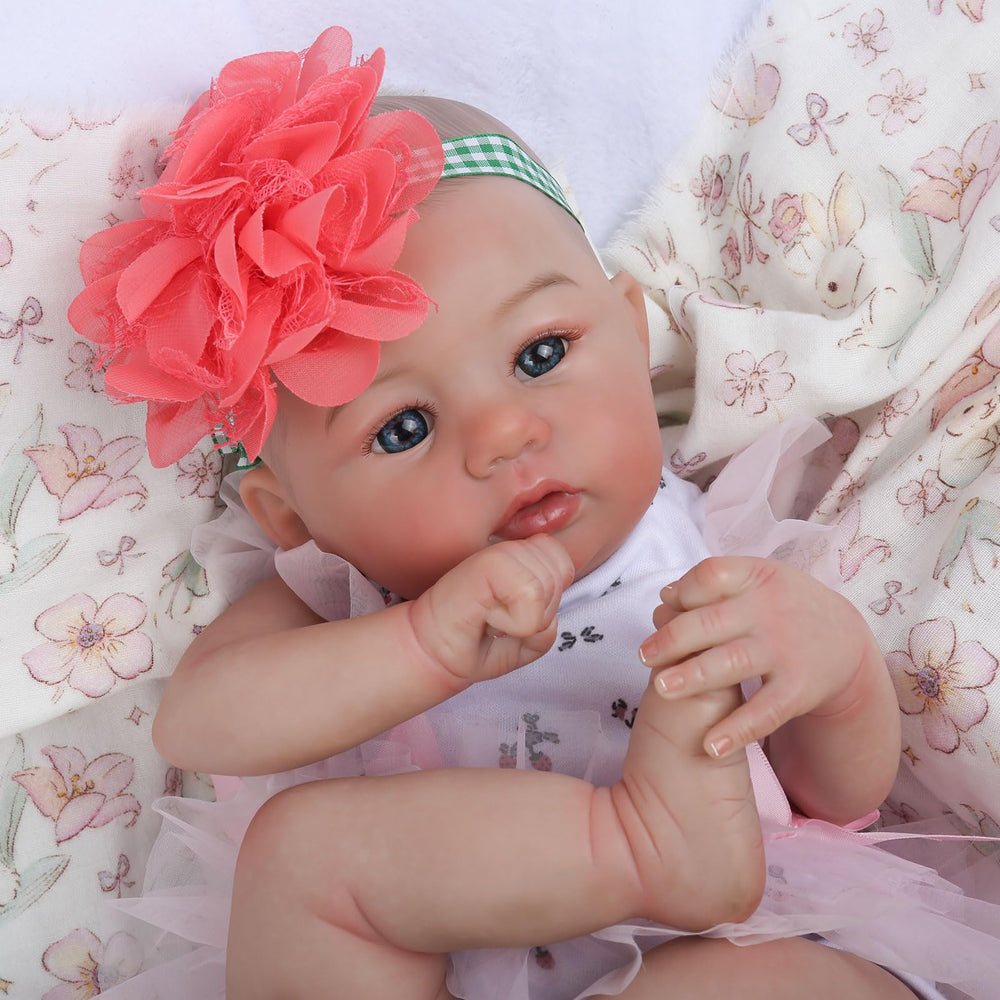 WOOROY reborn doll with blue eyes in a calm gaze for nurturing play.