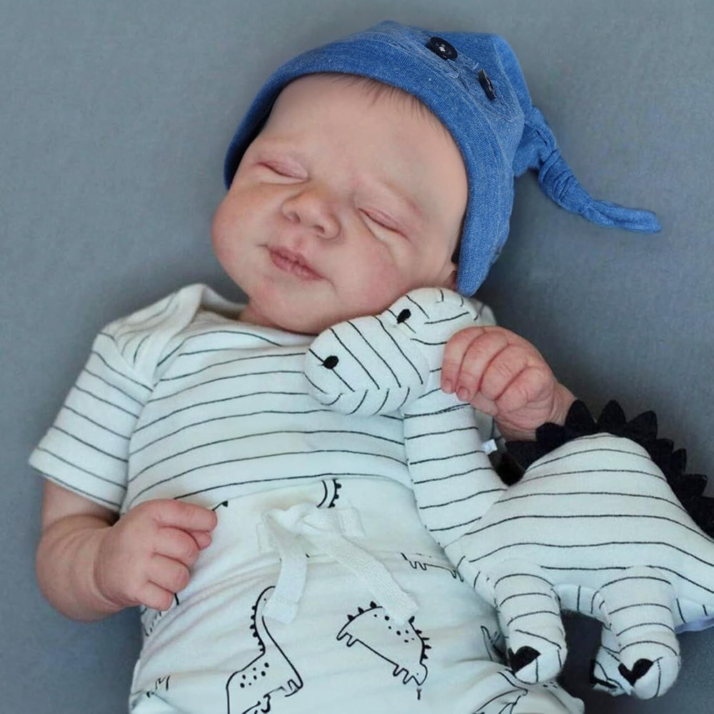 WOOROY reborn doll boy in sleeping pose with denim hat for cozy cuddles