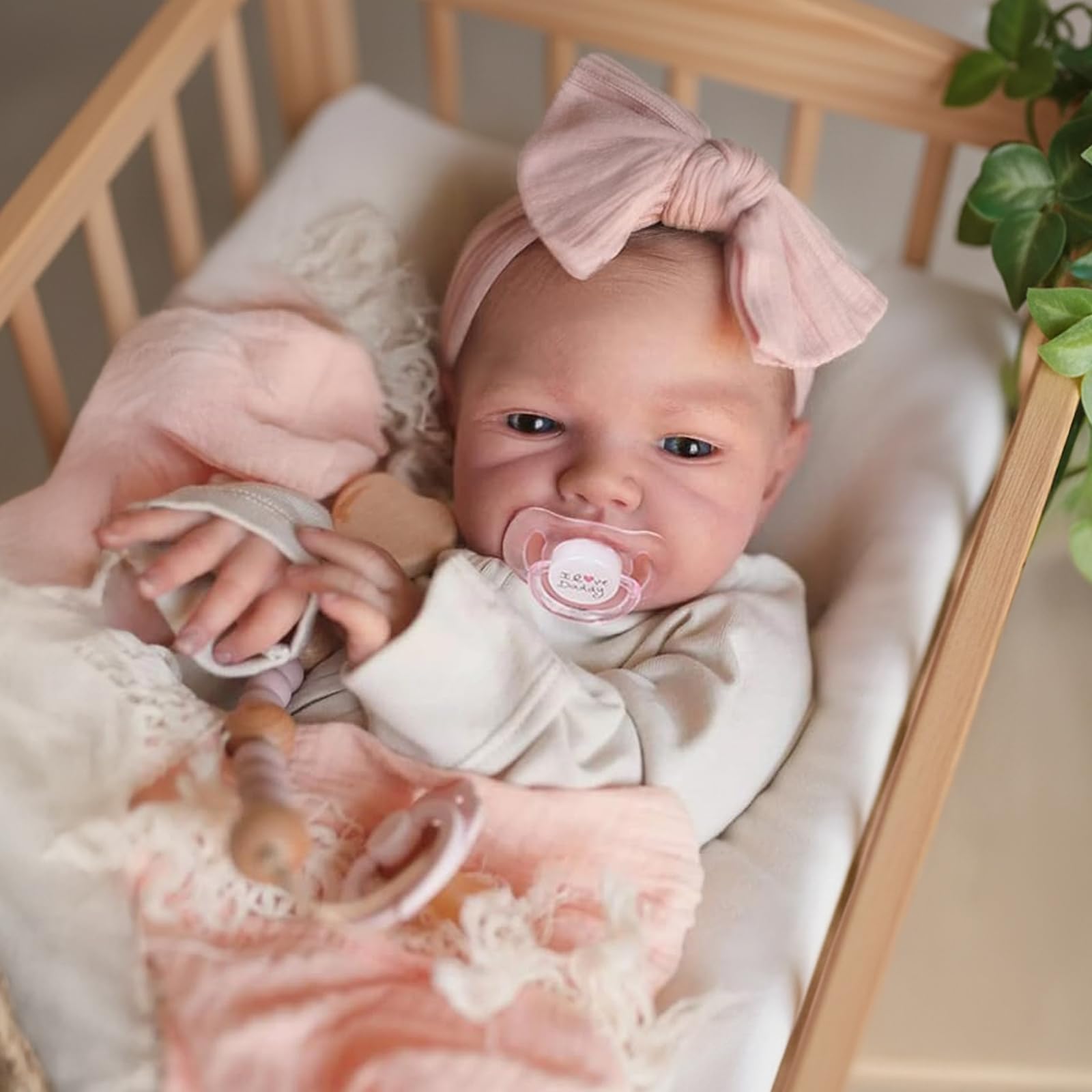 WOOROY Reborn doll in romper and headband showcases adorable newborn style for dressing games