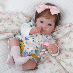WOOROY Reborn with rooted hair ready for natural styling and realistic newborn look.