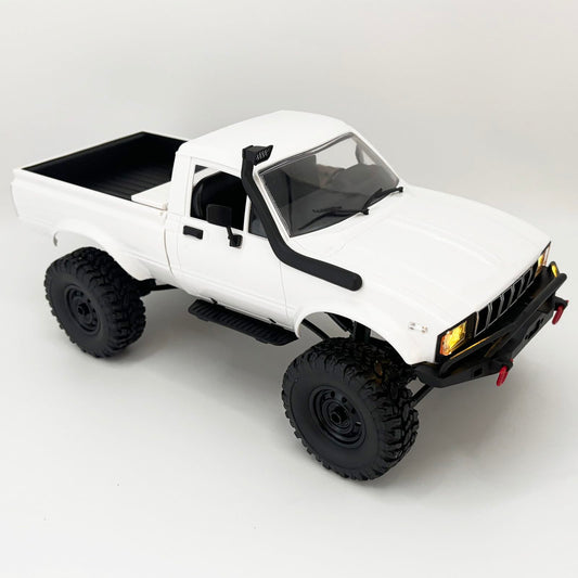 WPLDEWAN C24-1 with LED headlights for night-time off-road action.