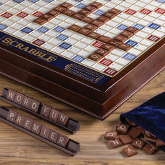 WS Game Company Scrabble Deluxe raised grid keeps tiles securely in place.