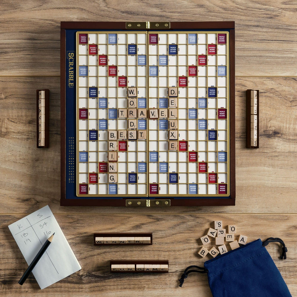 WS Game Company Scrabble Deluxe Travel raised grid board stabilizes tiles.