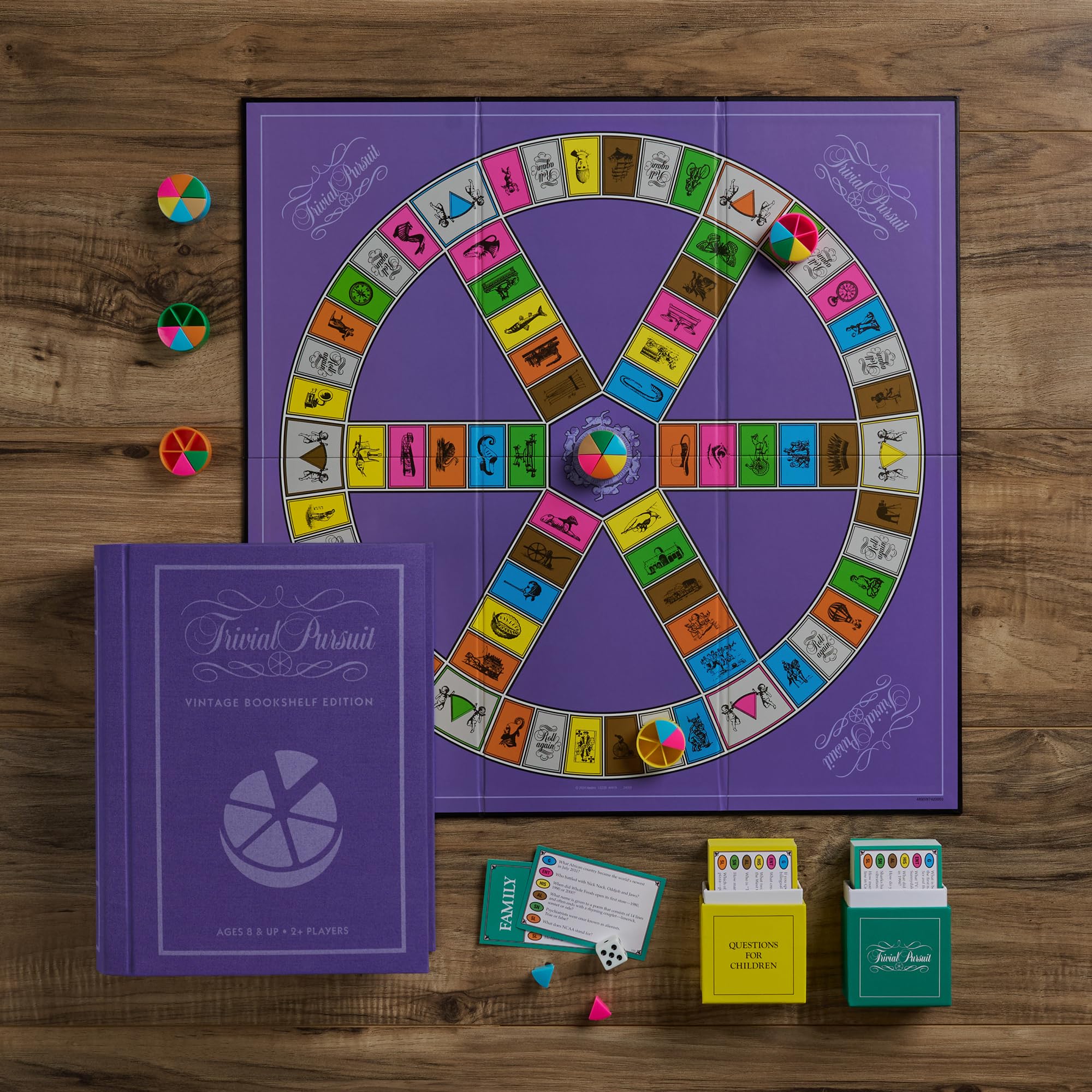 WS Game Company Trivial Pursuit Vintage Bookshelf Edition pie movers support clear scoring during play.