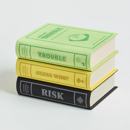 WS Game Company vintage bookshelf storage closeup with fabric wrap highlighting organization.