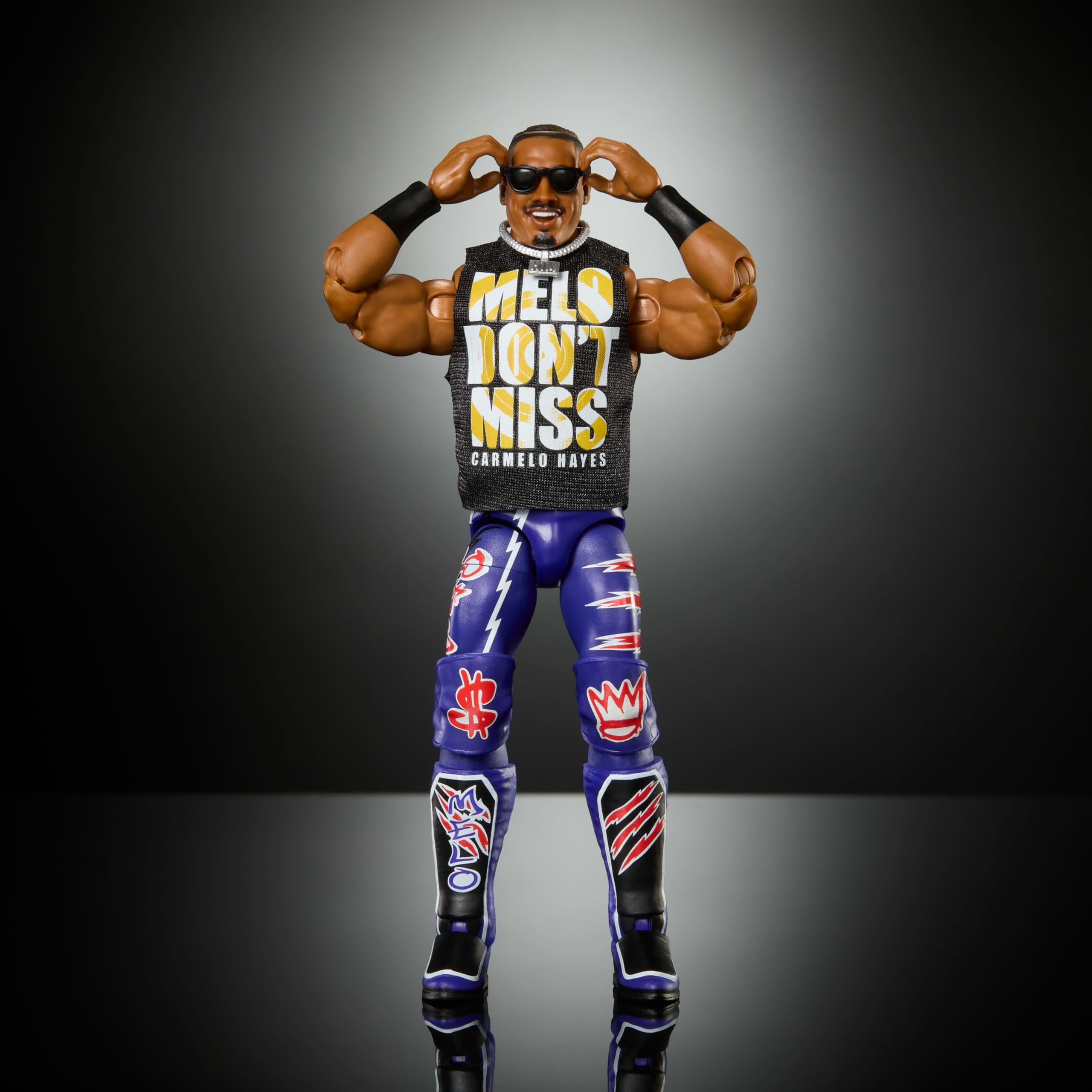WWE Carmelo Hayes Elite figure with swappable hands for customized scenes.
