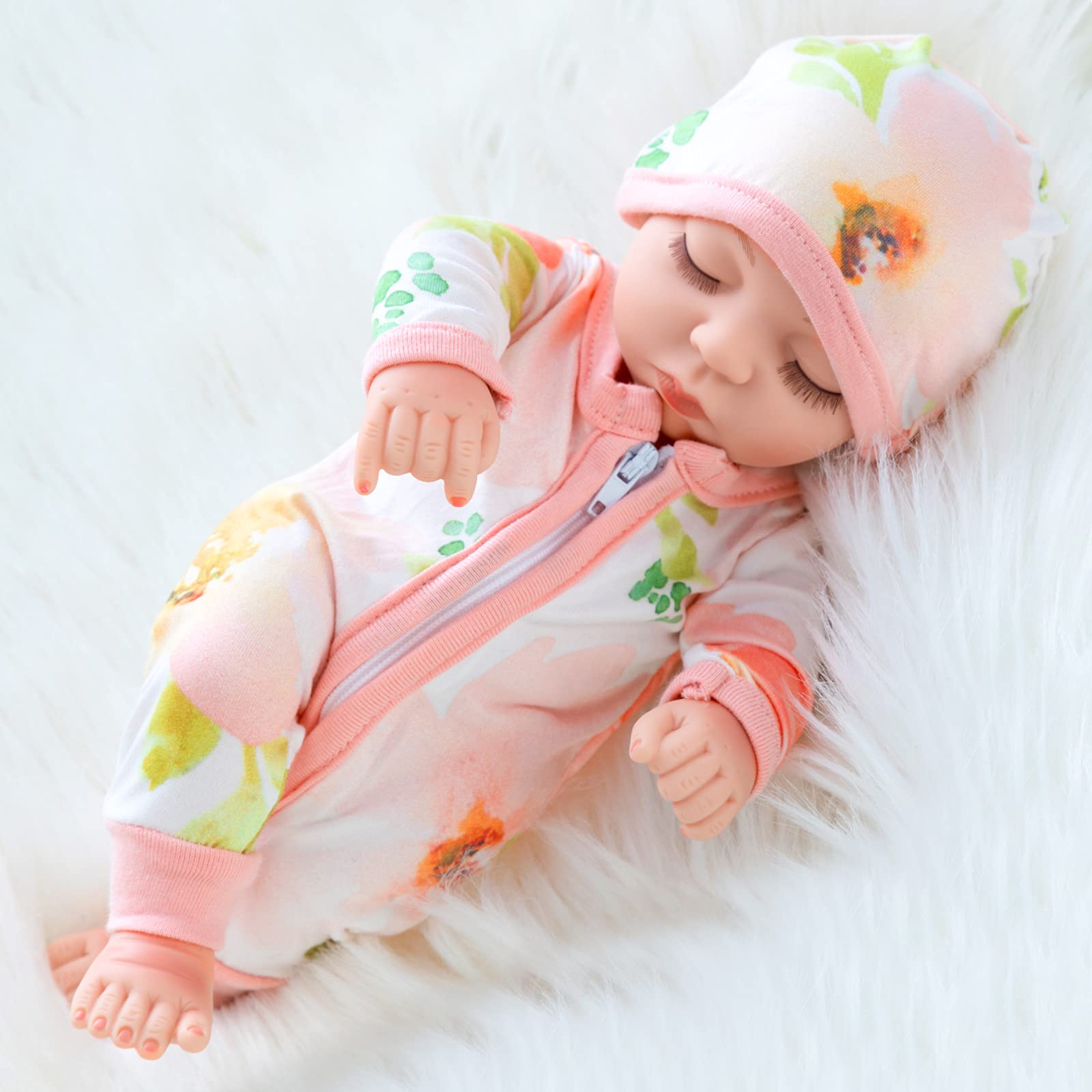 XFEYUE 10-inch newborn doll wearing jumpsuit and hat for cozy pretend play