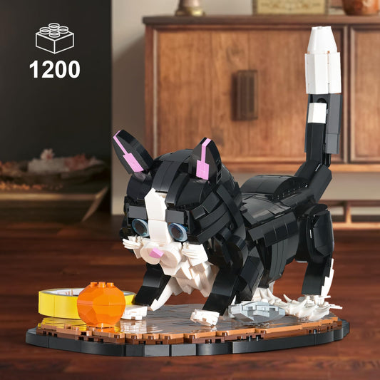 XITALAXU tuxedo cat building set shows movable paws and tail for dynamic posing.