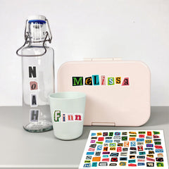 Yanroom DIY projects with letters on laptops, mugs, and cases.
