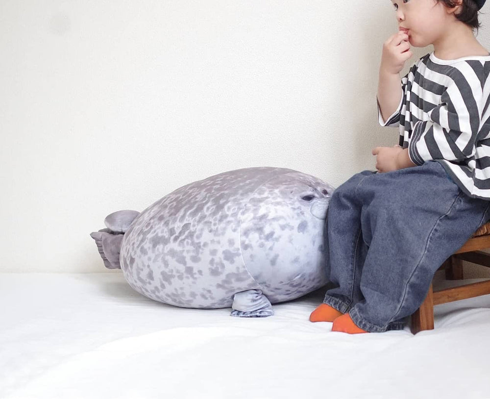 YESGIRL seal plush pillow close-up eyes adds playful charm to a kid's room.