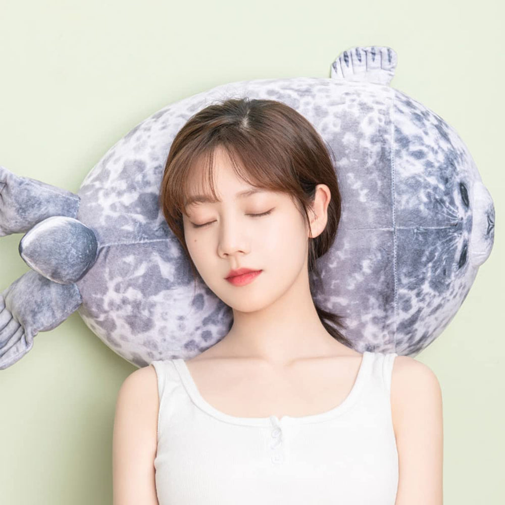 YESGIRL seal plush pillow used as a cuddle companion for adults.