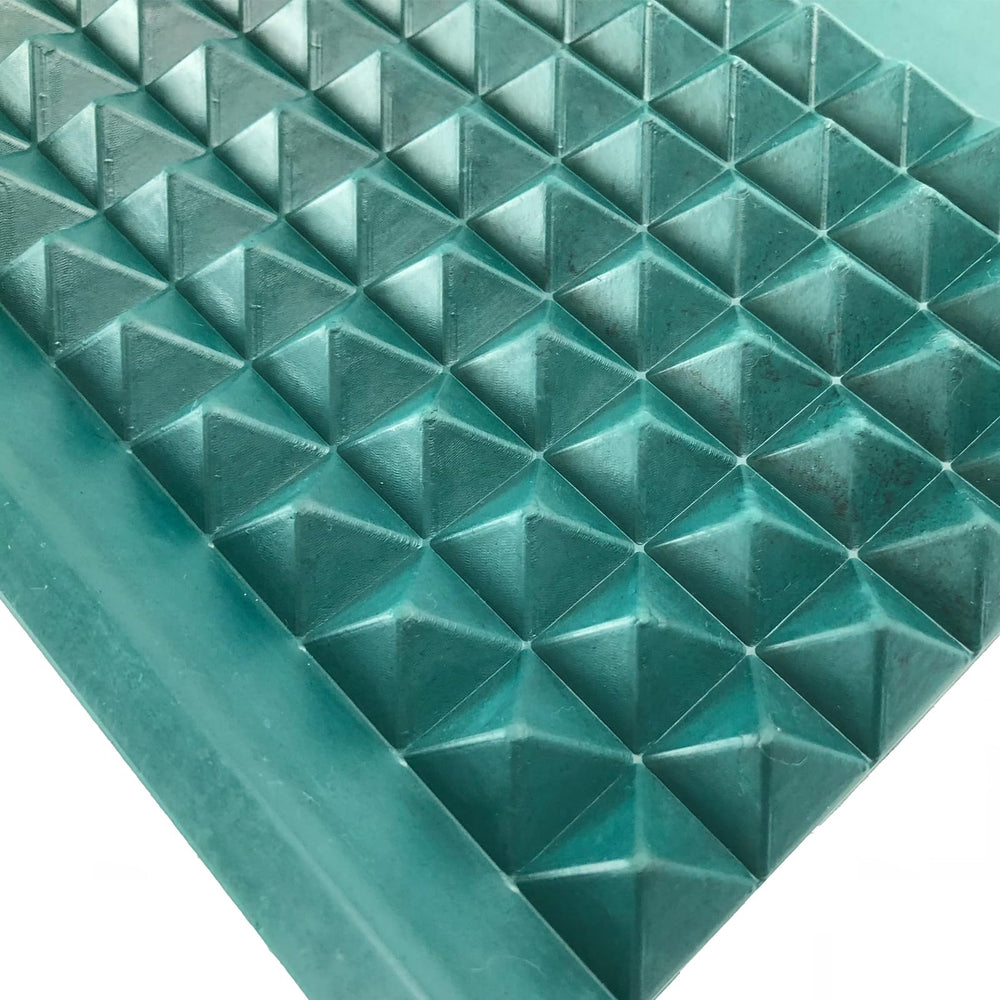 Close-up shows pyramid bumpers guiding dice rolls