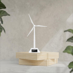 Yiluren windmill on window sill enjoys bright sun