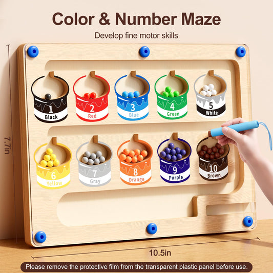 Yisryerow wooden wand and beads demonstrate fine motor control during play.